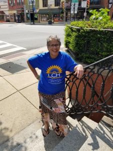 Cathy, an LCH patient, stands with a smile in downtown Oxford.