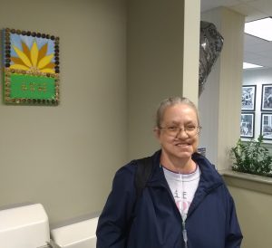 Linda smiles in the waiting room of LCH West Grove