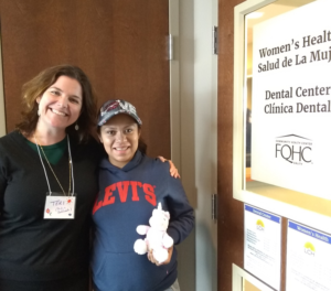 Photo of Teri Noone, CNM, Certified Nurse Midwife, smiling with Pregnancy Centering patient after a group visit