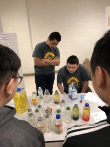 high school students demonstrate how to make homemade lava lamps