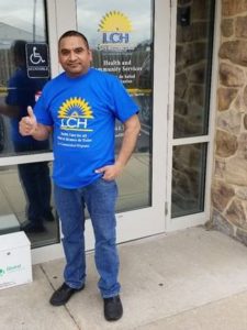 Photo of patient standing in front of LCH health center in Kennett Square