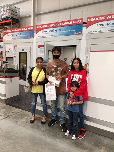 Rogelio and his family at Costco waiting for his hearingaids