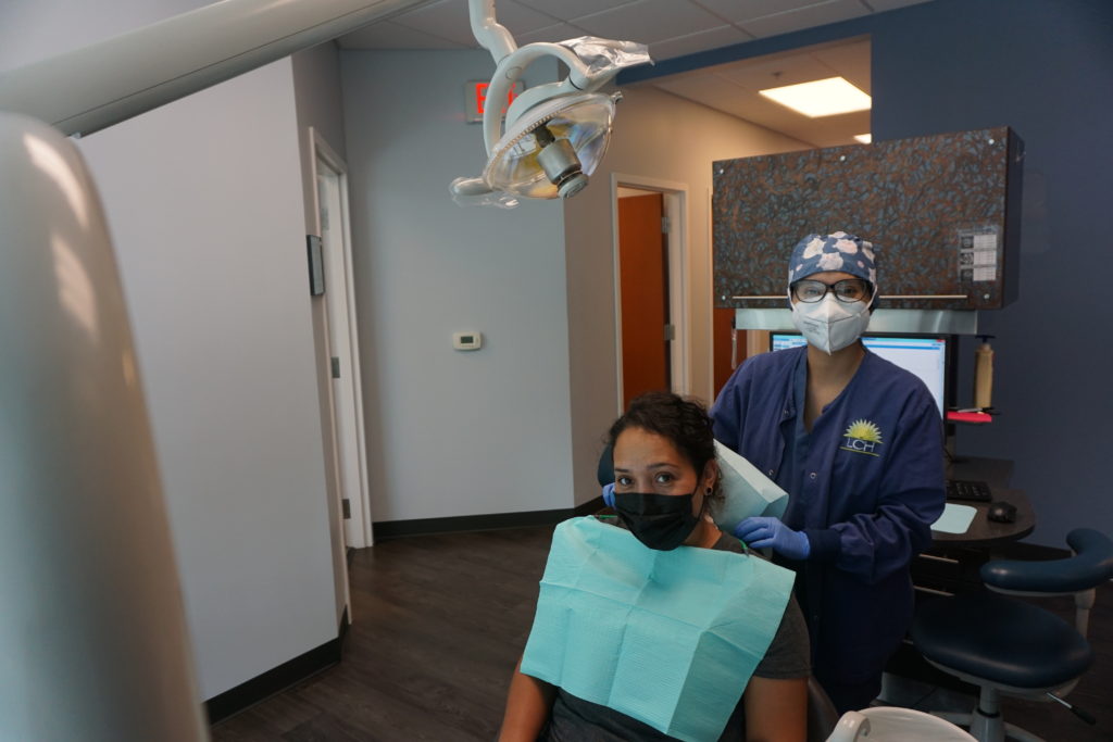 Dental Patient with Dental Assistant before Cleaning