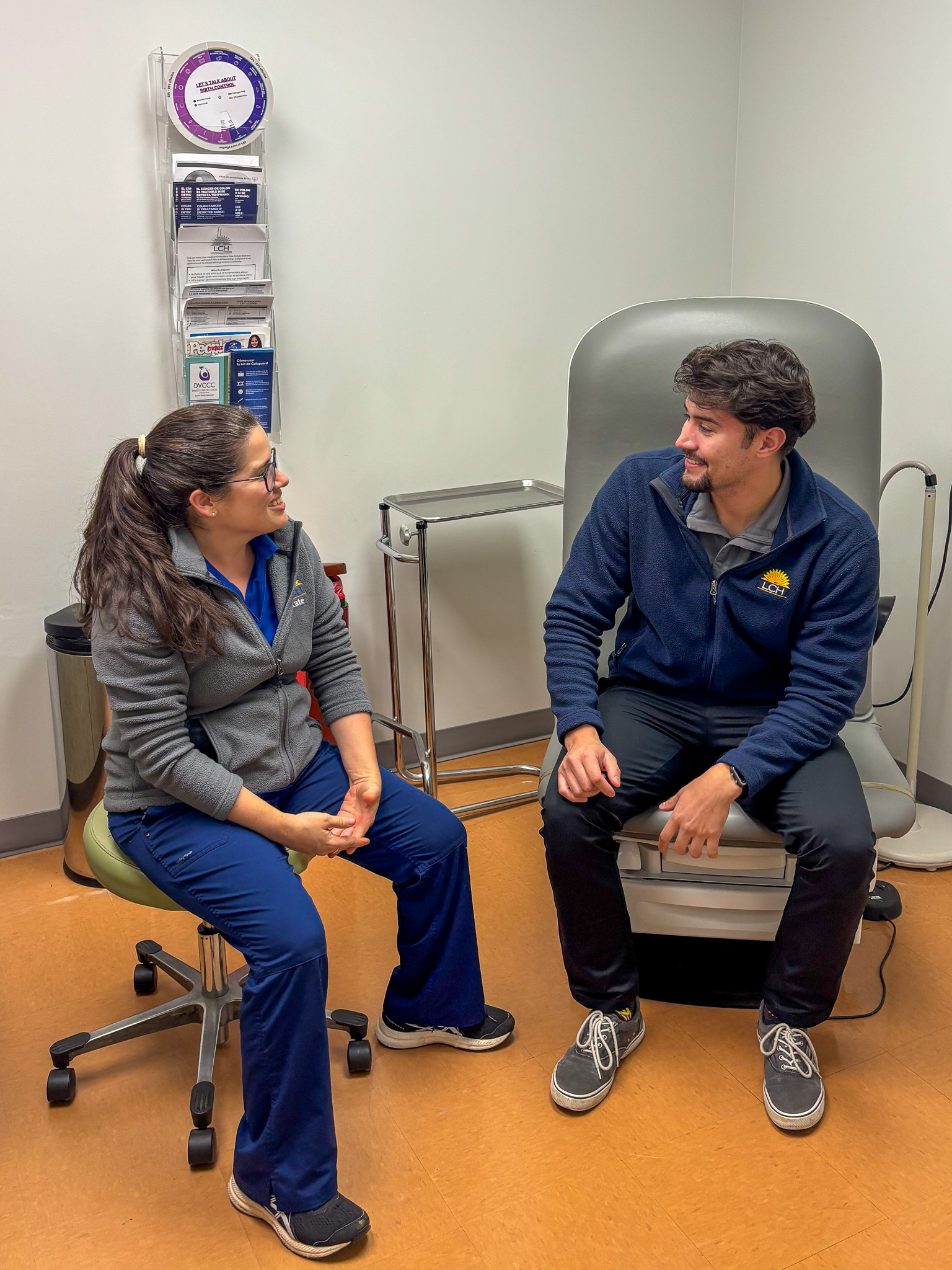 Image of provider Kate and patient Christian talking in patient room